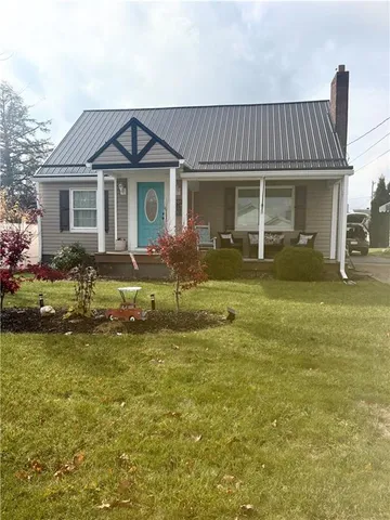 a kitchen with granite countertop stainless steel appliances a refrigerator a sink and cabinets