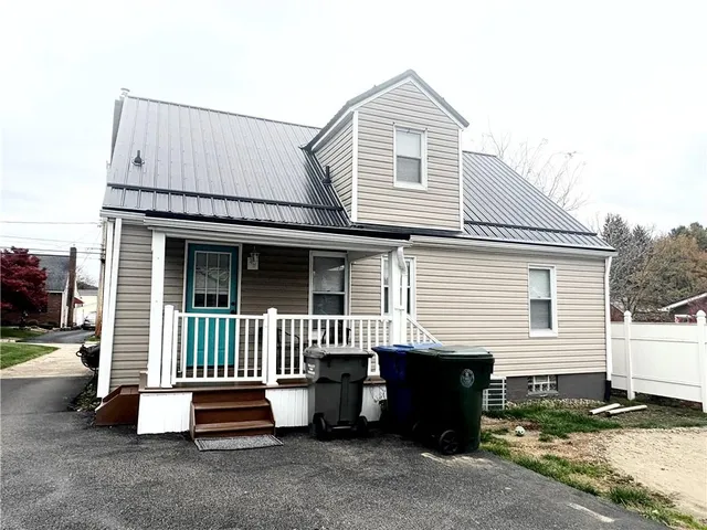 a kitchen with granite countertop a sink and a stove