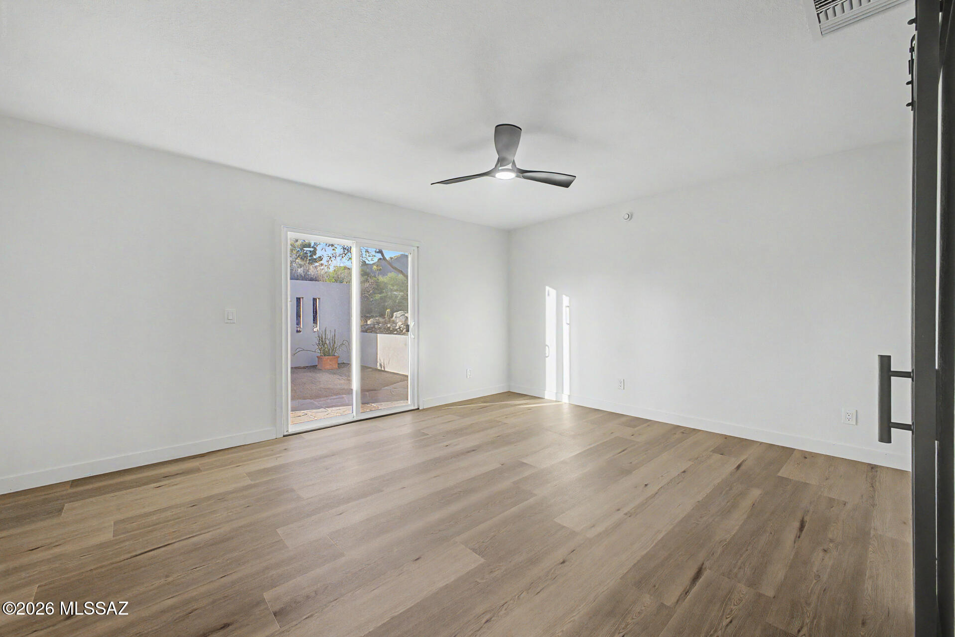 333 East Florence Road Tucson, AZ 85704 - Photo 16 of 49 PRIMARY BEDROOM WITH SLIDER TO COURTYARD AND BACKYARD