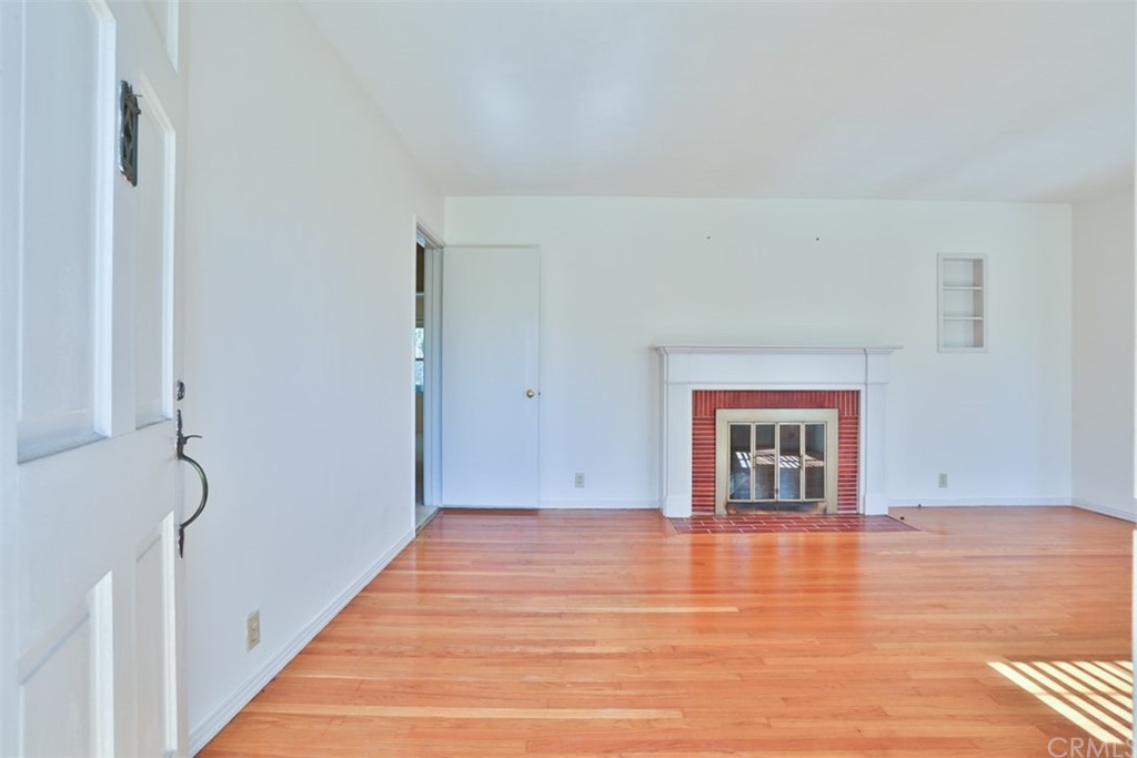2235 Garfias Drive Pasadena, CA 91104 - Photo 2 of 40 a view of an empty room with wooden floor and a window