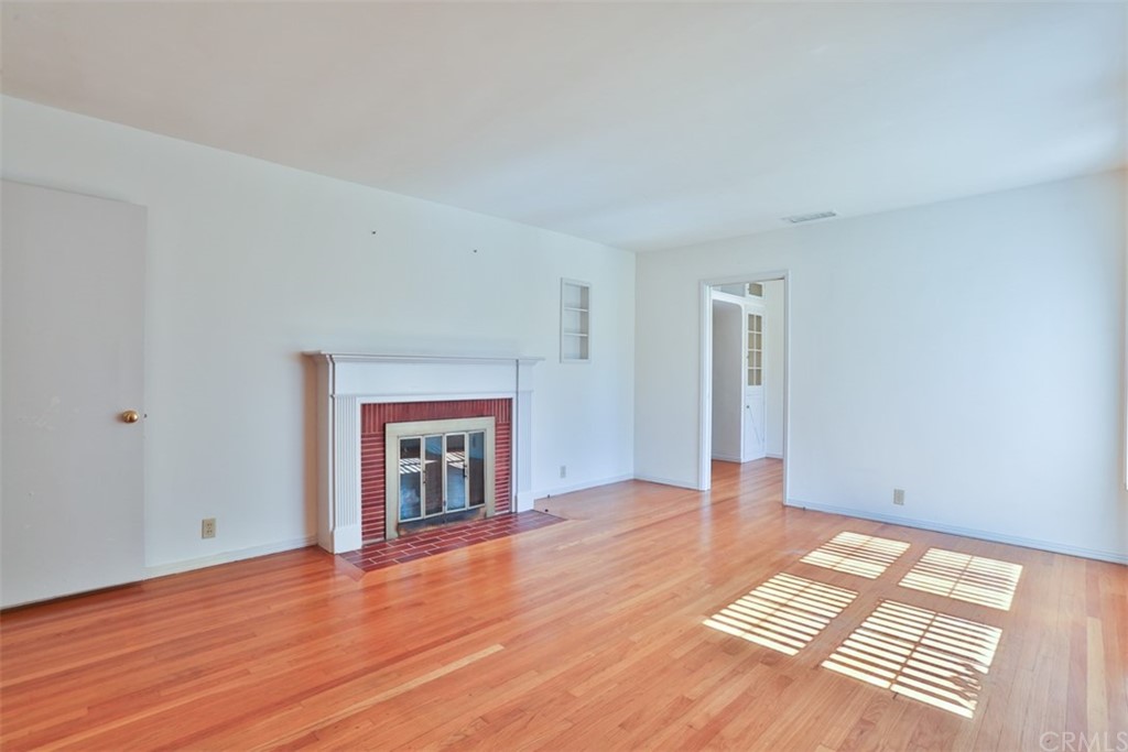 2235 Garfias Drive Pasadena, CA 91104 - Photo 3 of 40 a view of an empty room with wooden floor and a window