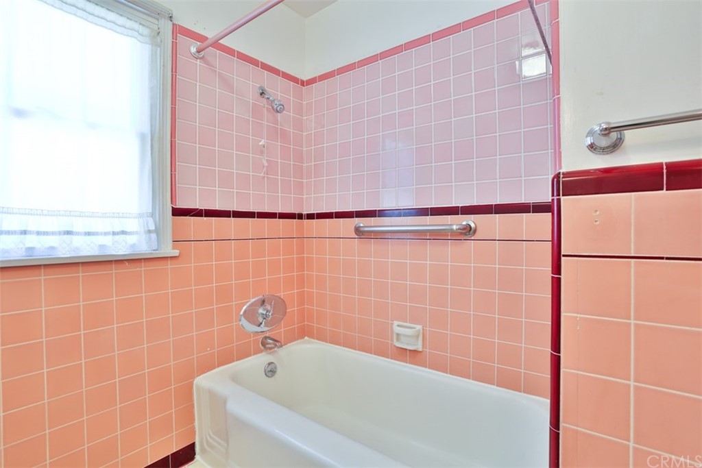 2235 Garfias Drive Pasadena, CA 91104 - Photo 23 of 40 a bathroom with a bathtub and shower