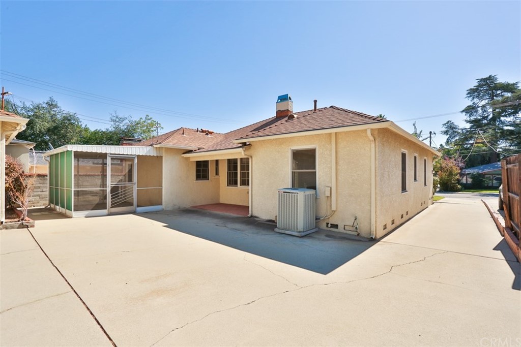 2235 Garfias Drive Pasadena, CA 91104 - Photo 25 of 40 a front view of a house with a yard and garage