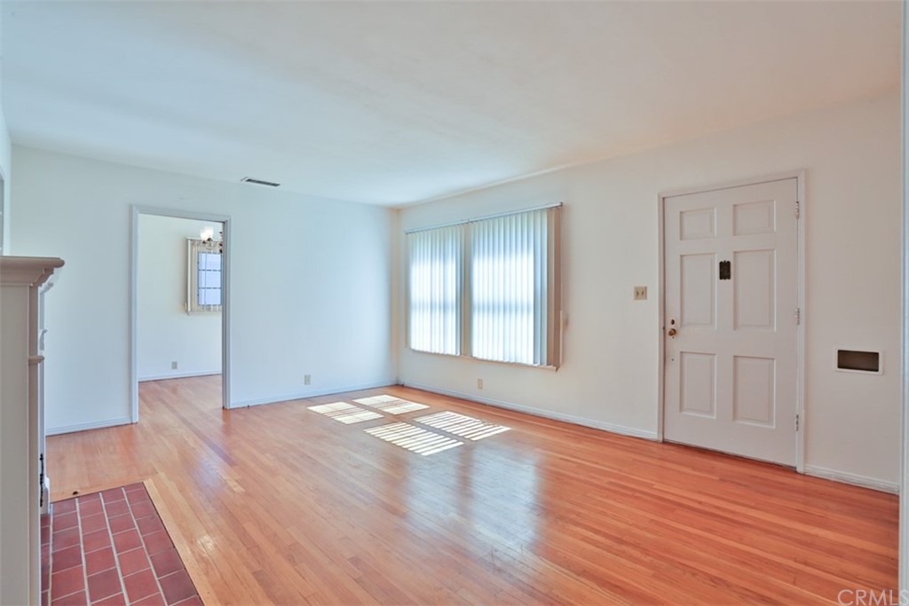 2235 Garfias Drive Pasadena, CA 91104 - Photo 4 of 40 a view of an empty room with wooden floor and a window
