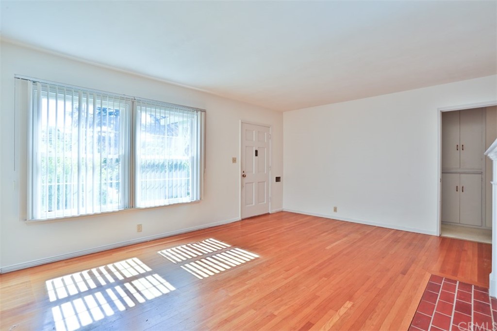 2235 Garfias Drive Pasadena, CA 91104 - Photo 6 of 40 a view of an empty room with wooden floor and a window