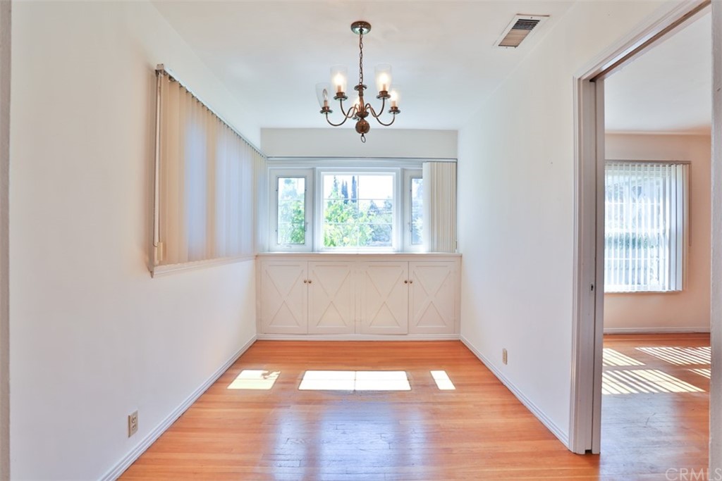 2235 Garfias Drive Pasadena, CA 91104 - Photo 7 of 40 a view of an empty room with wooden floor and a window