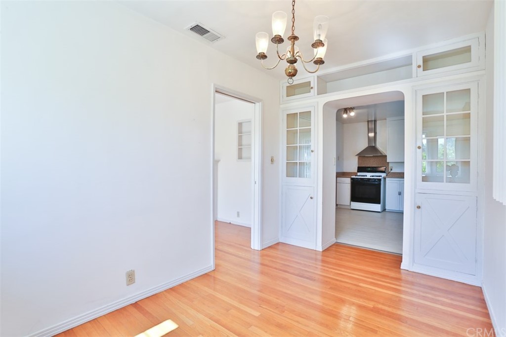 2235 Garfias Drive Pasadena, CA 91104 - Photo 8 of 40 a view of a livingroom with wooden floor and kitchen
