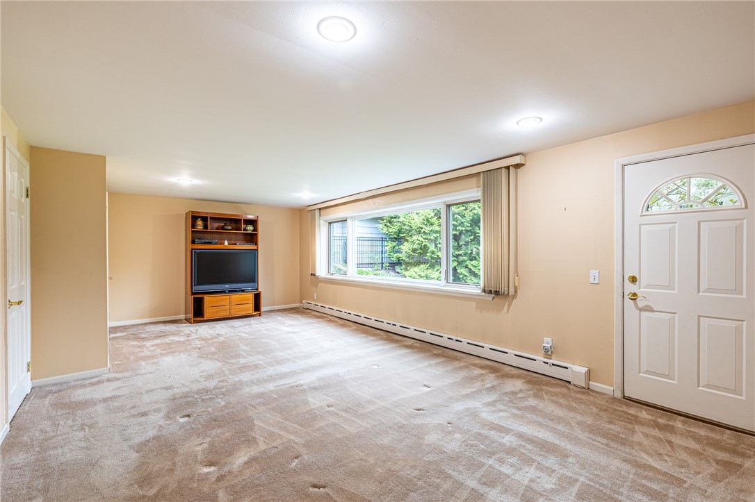 1615 Clover Street Brighton, NY 14618 - Photo 18 of 48 Large entertainment room in the first floor level.