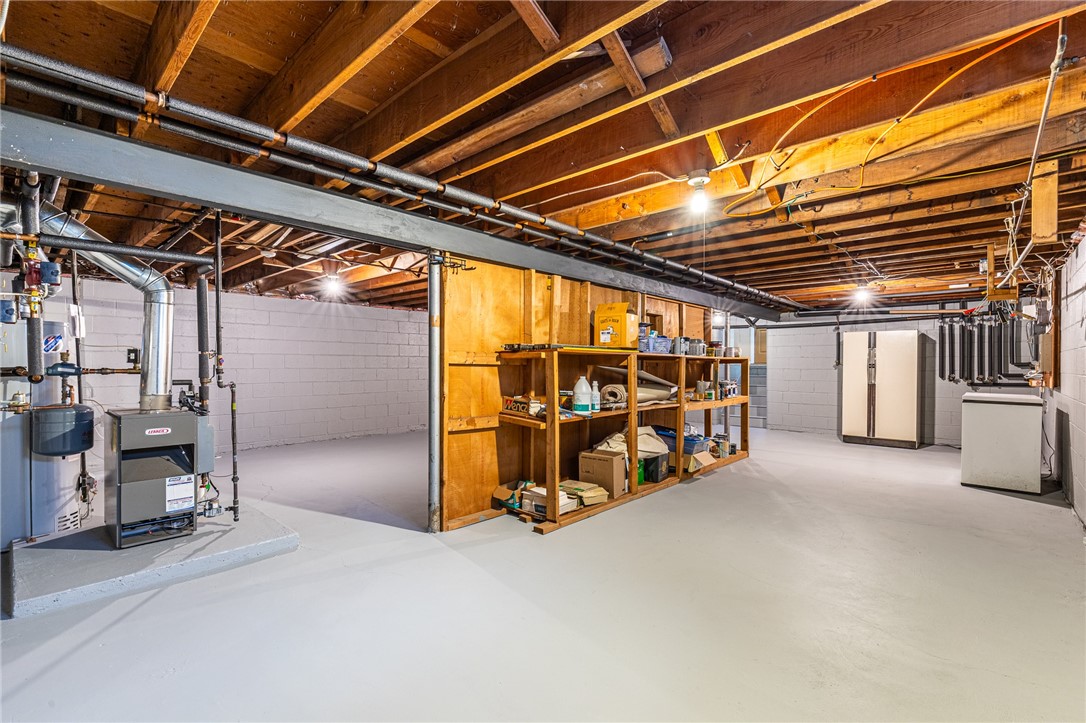 1615 Clover Street Brighton, NY 14618 - Photo 39 of 48 Basement with view of the boiler and the large ref