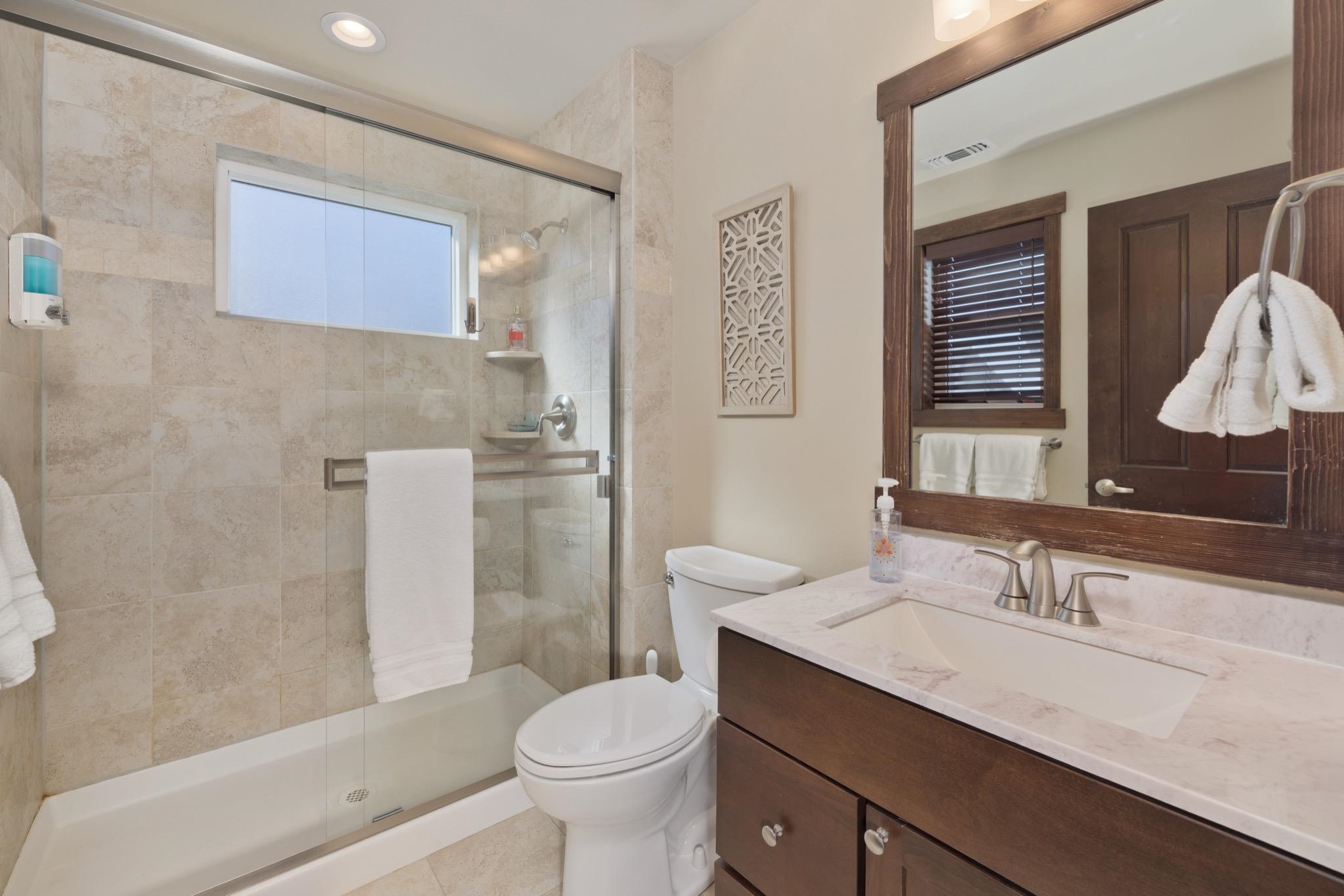28 Oak Tree Way, Unit 8 Mammoth Lakes, CA 93546 - Photo 21 of 32 a bathroom with a granite countertop sink toilet and shower