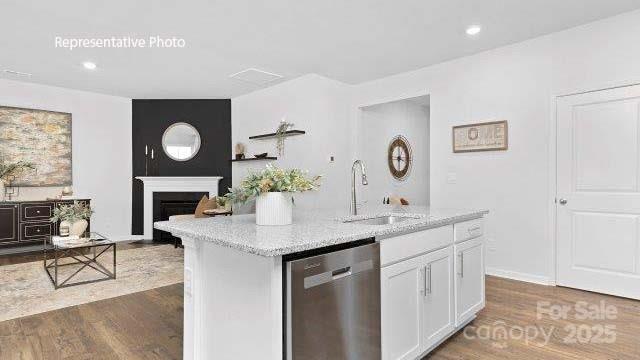 1039 Horizon Lane Chester, SC 29706 - Photo 6 of 21 a dining hall with stainless steel appliances granite countertop a sink a stove and a wooden floors