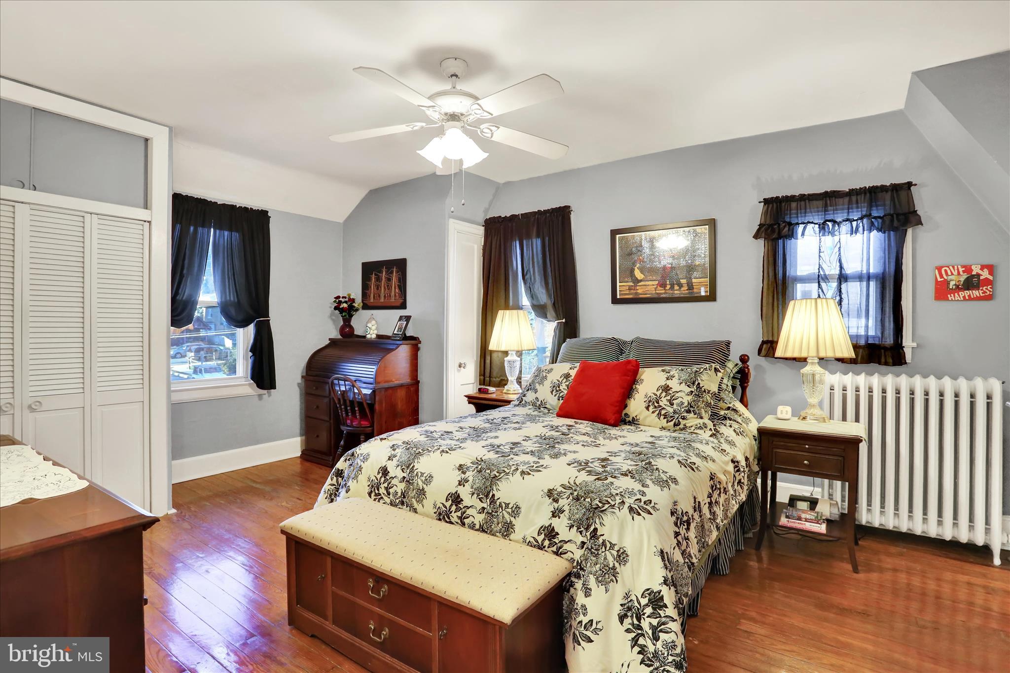117 Center Street Reading, PA 19606 - Photo 17 of 28 a bedroom with a bed and wooden floor