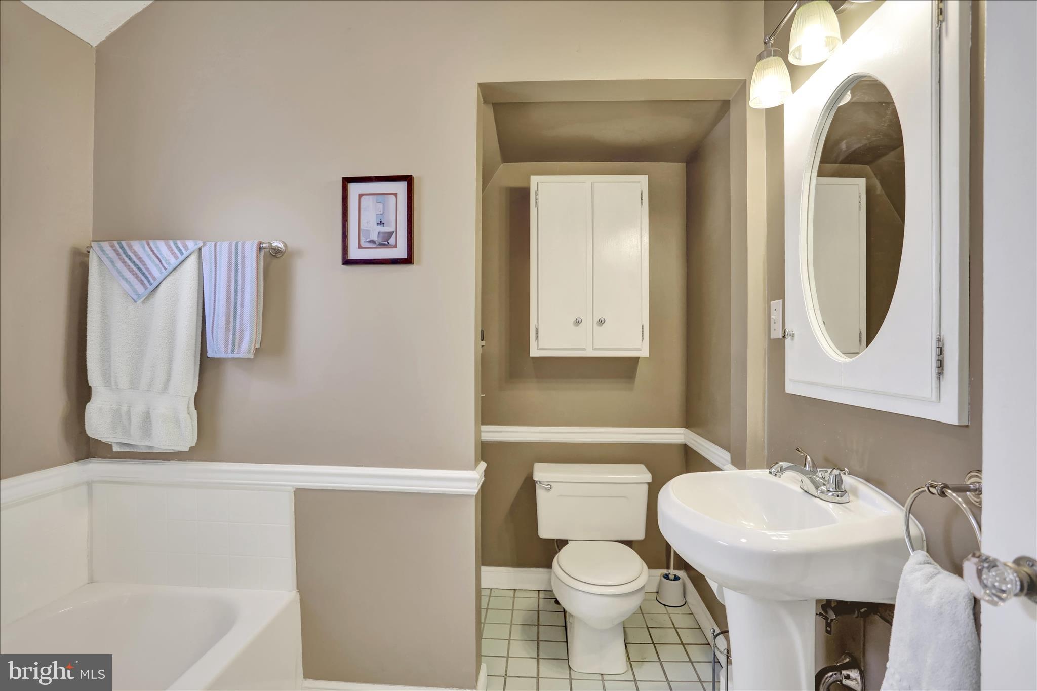 117 Center Street Reading, PA 19606 - Photo 19 of 28 a bathroom with a sink toilet and a mirror