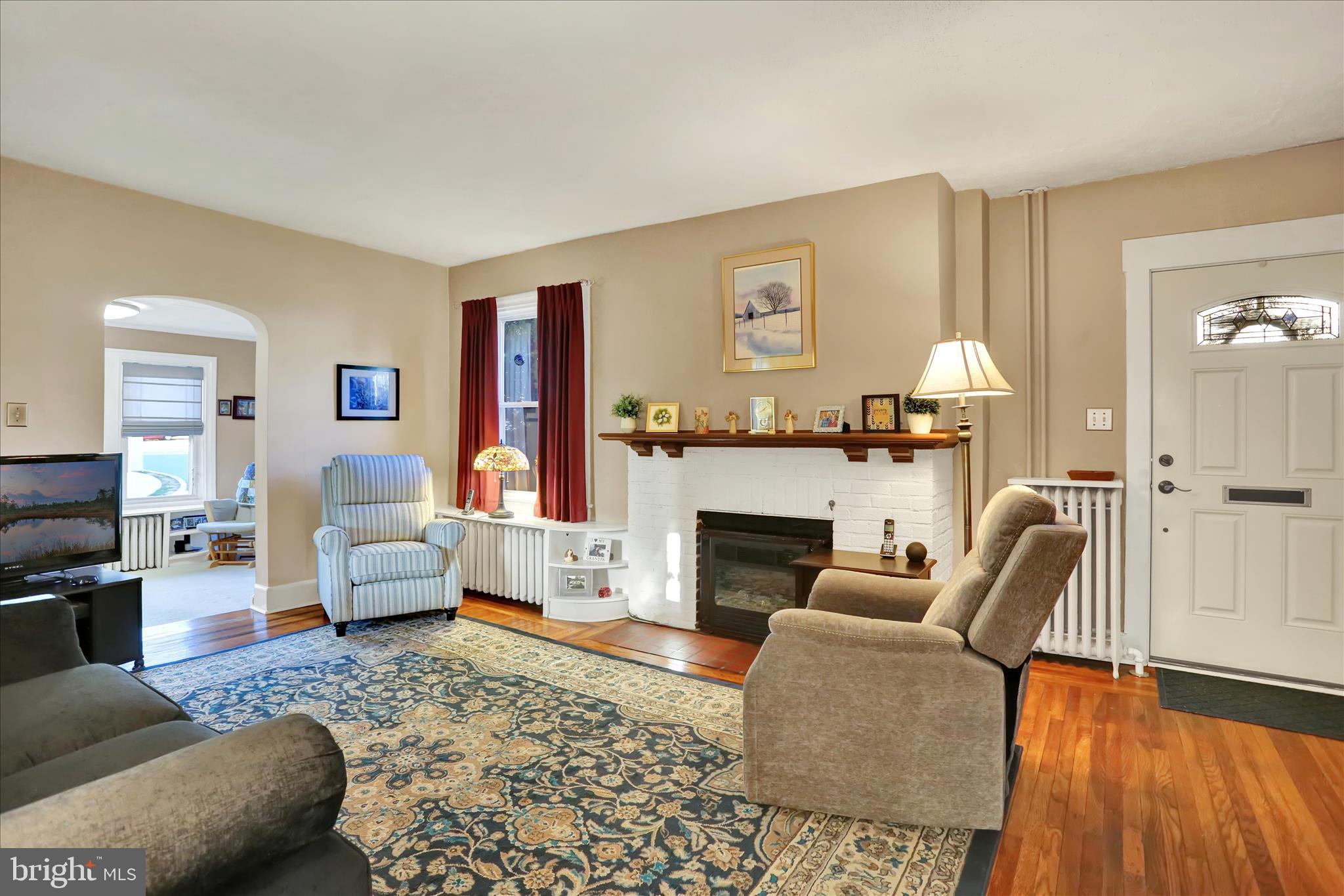 117 Center Street Reading, PA 19606 - Photo 2 of 28 a living room with furniture and a fireplace