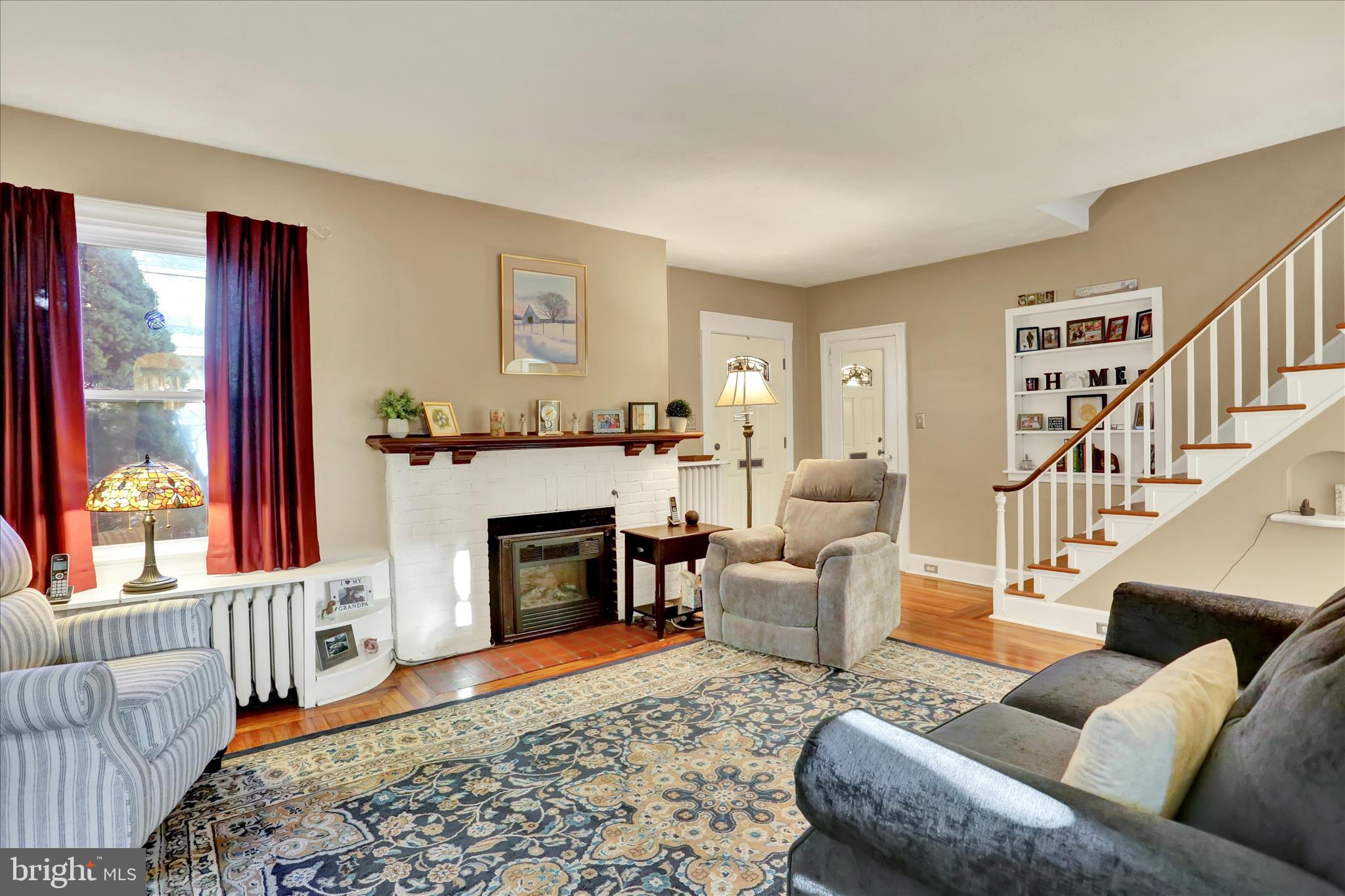 117 Center Street Reading, PA 19606 - Photo 3 of 28 a living room with furniture and a fireplace