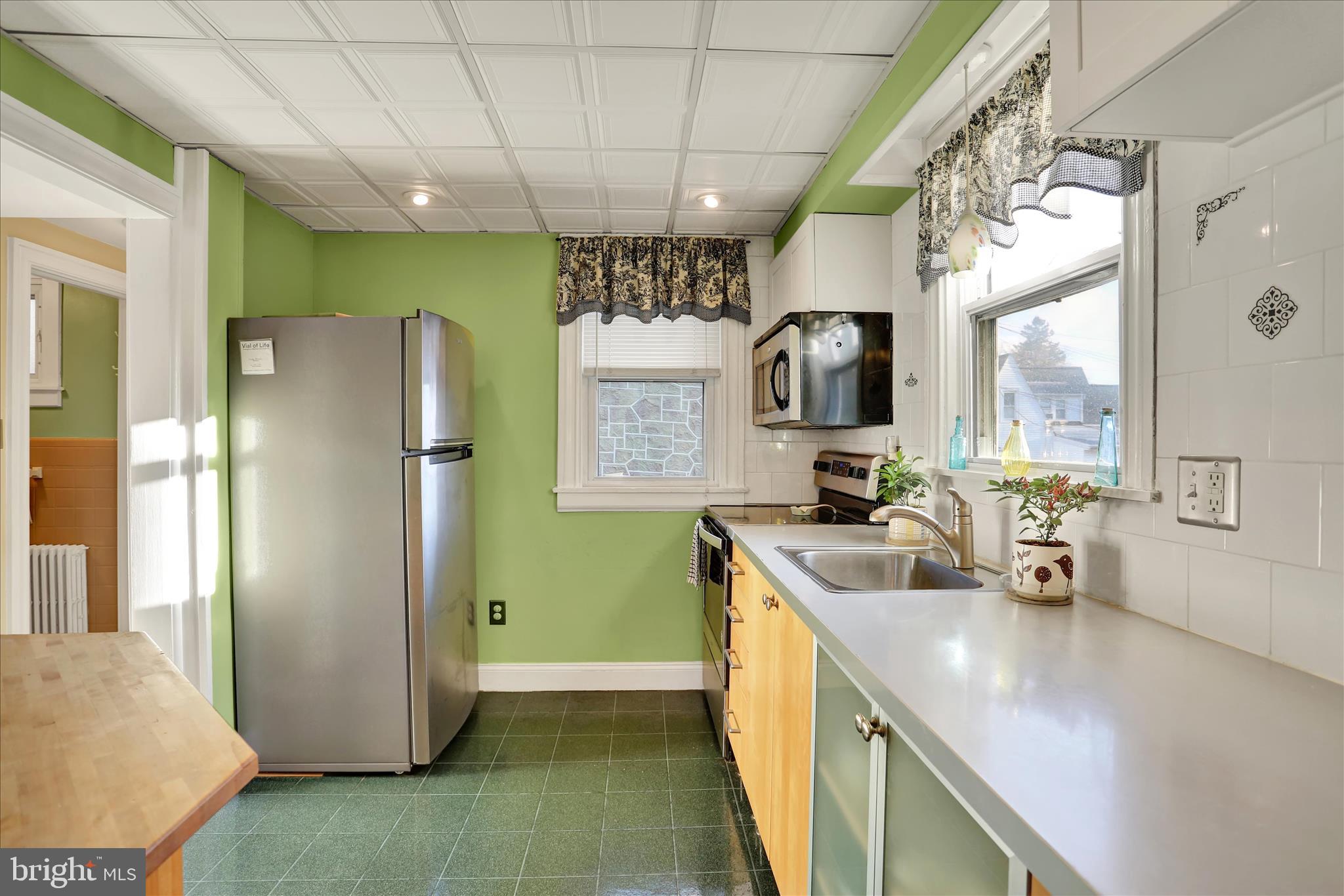 117 Center Street Reading, PA 19606 - Photo 5 of 28 a kitchen with refrigerator and window