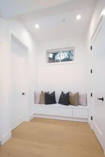 a workspace with a window and chair
