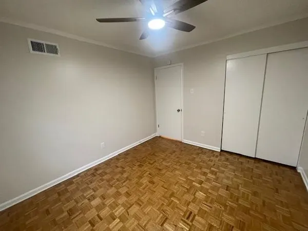 an empty room with a empty space and windows