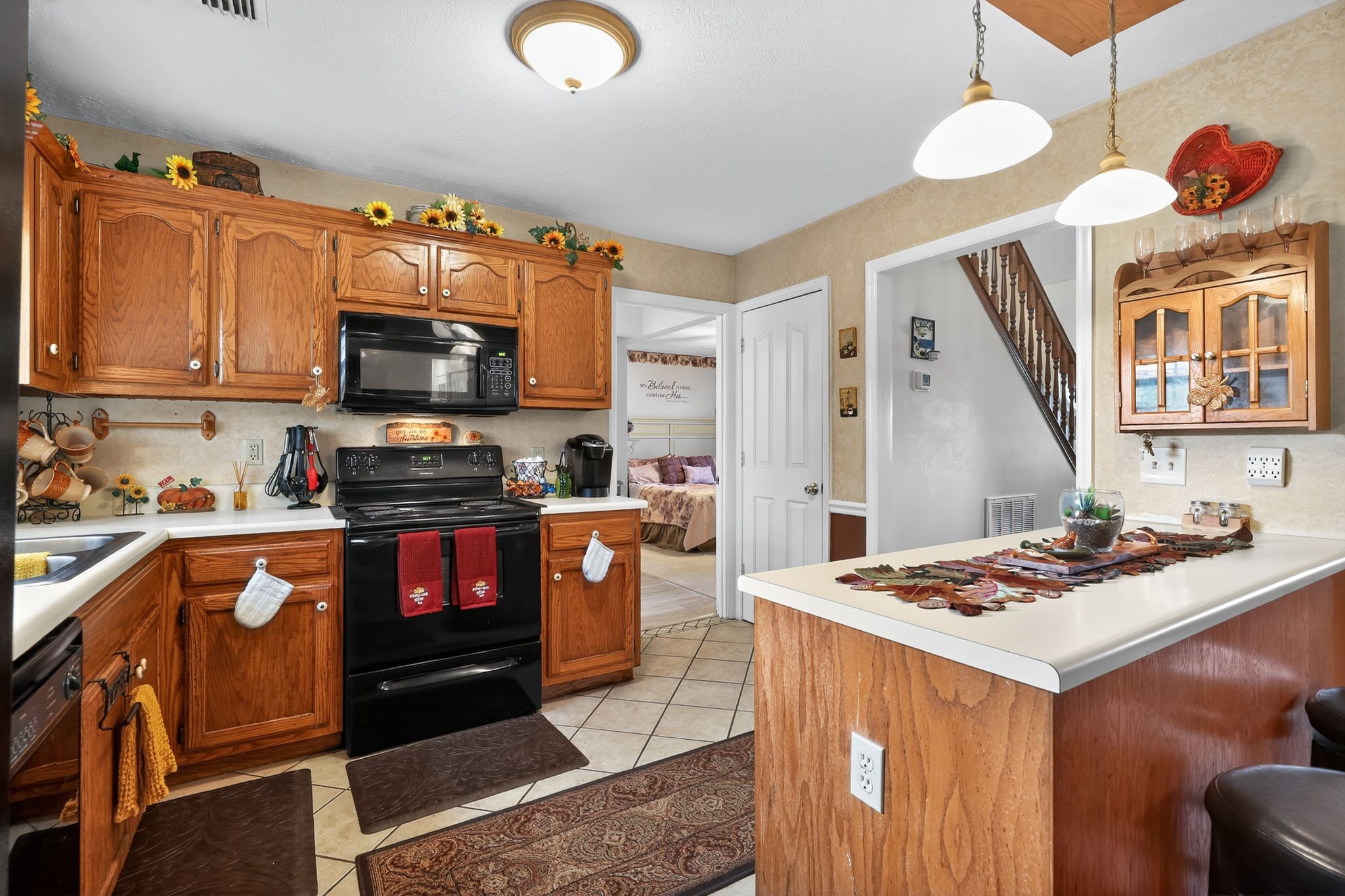 1419 Cason Trail Murfreesboro, TN 37128 - Photo 11 of 25 a kitchen with granite countertop a stove top oven microwave and cabinets