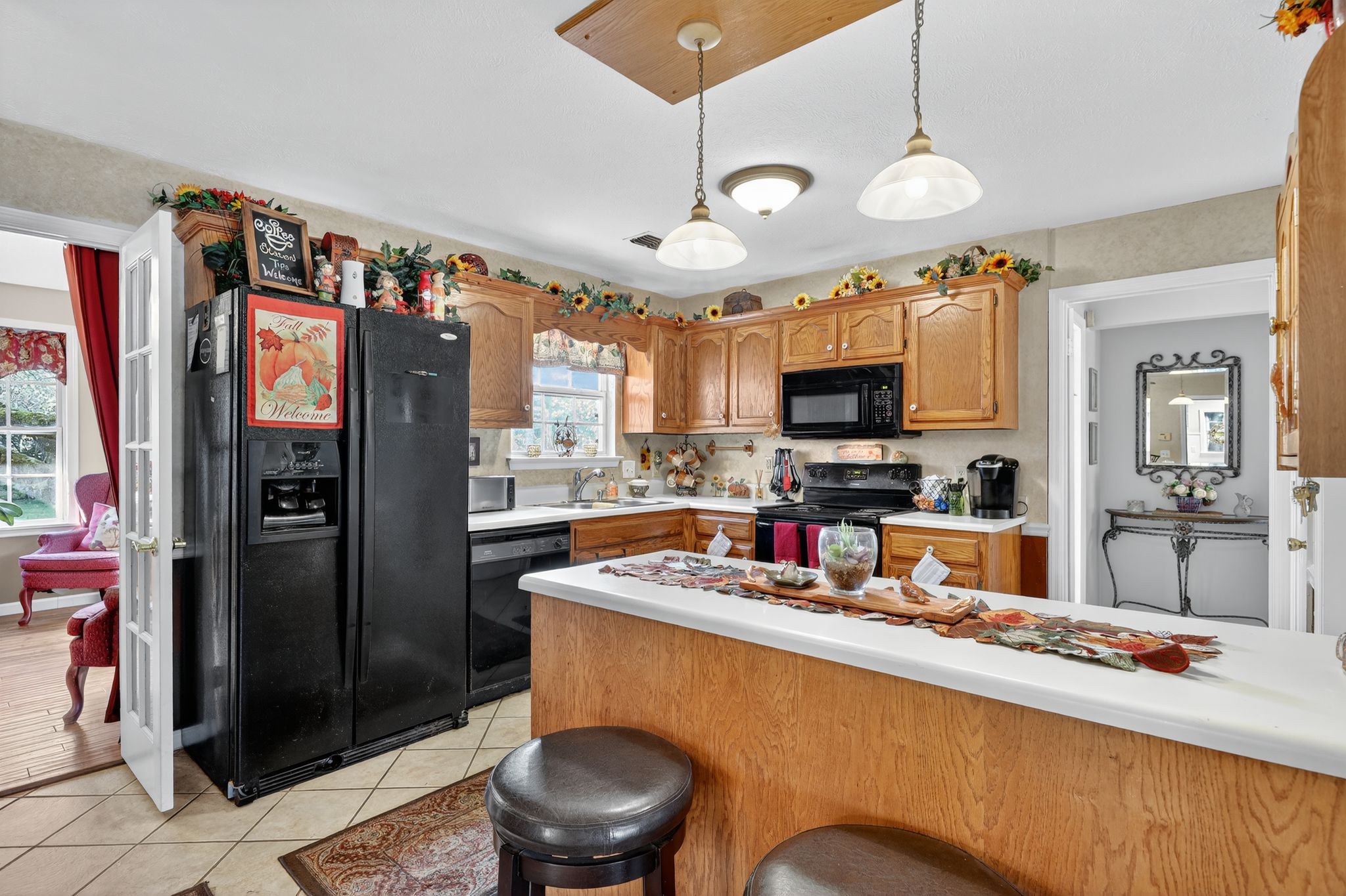 1419 Cason Trail Murfreesboro, TN 37128 - Photo 12 of 25 a kitchen with stainless steel appliances granite countertop a refrigerator a oven a sink a stove and a dining table with wooden floor