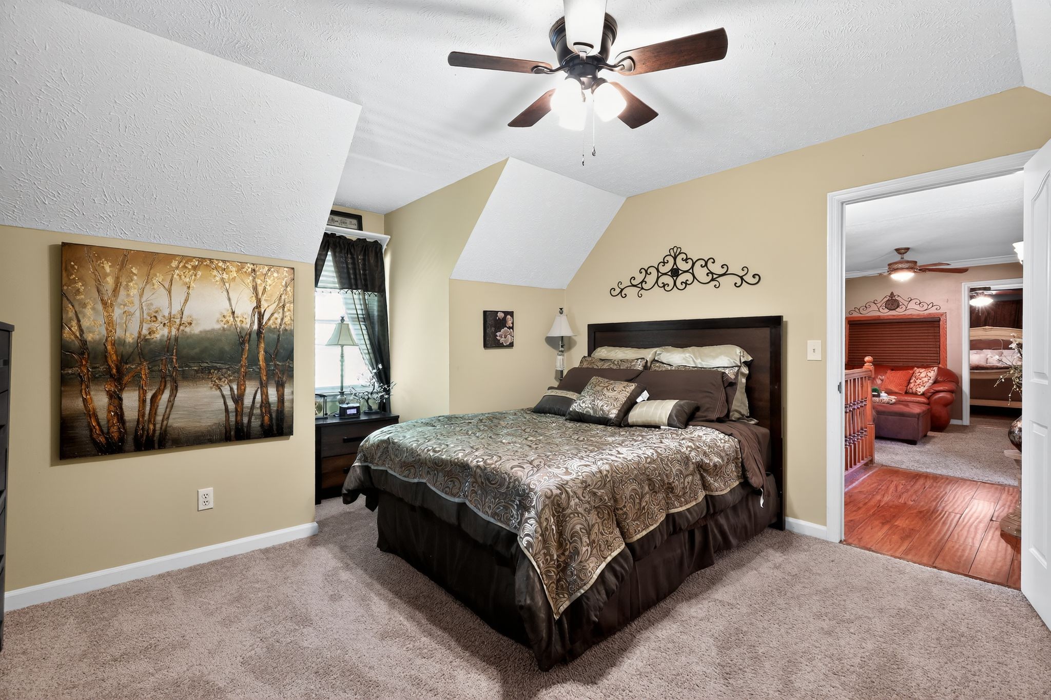 1419 Cason Trail Murfreesboro, TN 37128 - Photo 16 of 25 a bedroom with a large bed and a chandelier