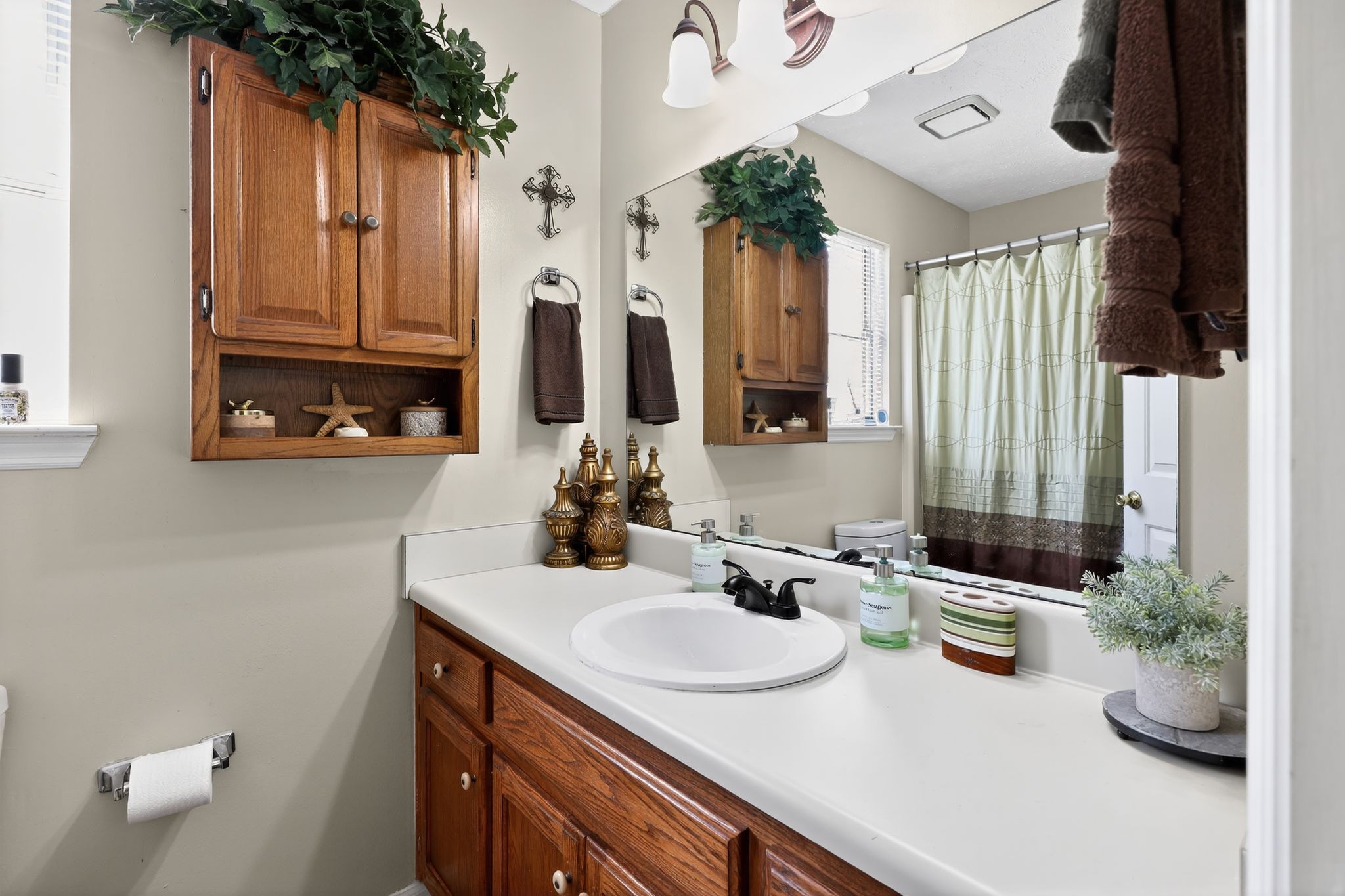 1419 Cason Trail Murfreesboro, TN 37128 - Photo 5 of 25 a bathroom with a sink and a mirror