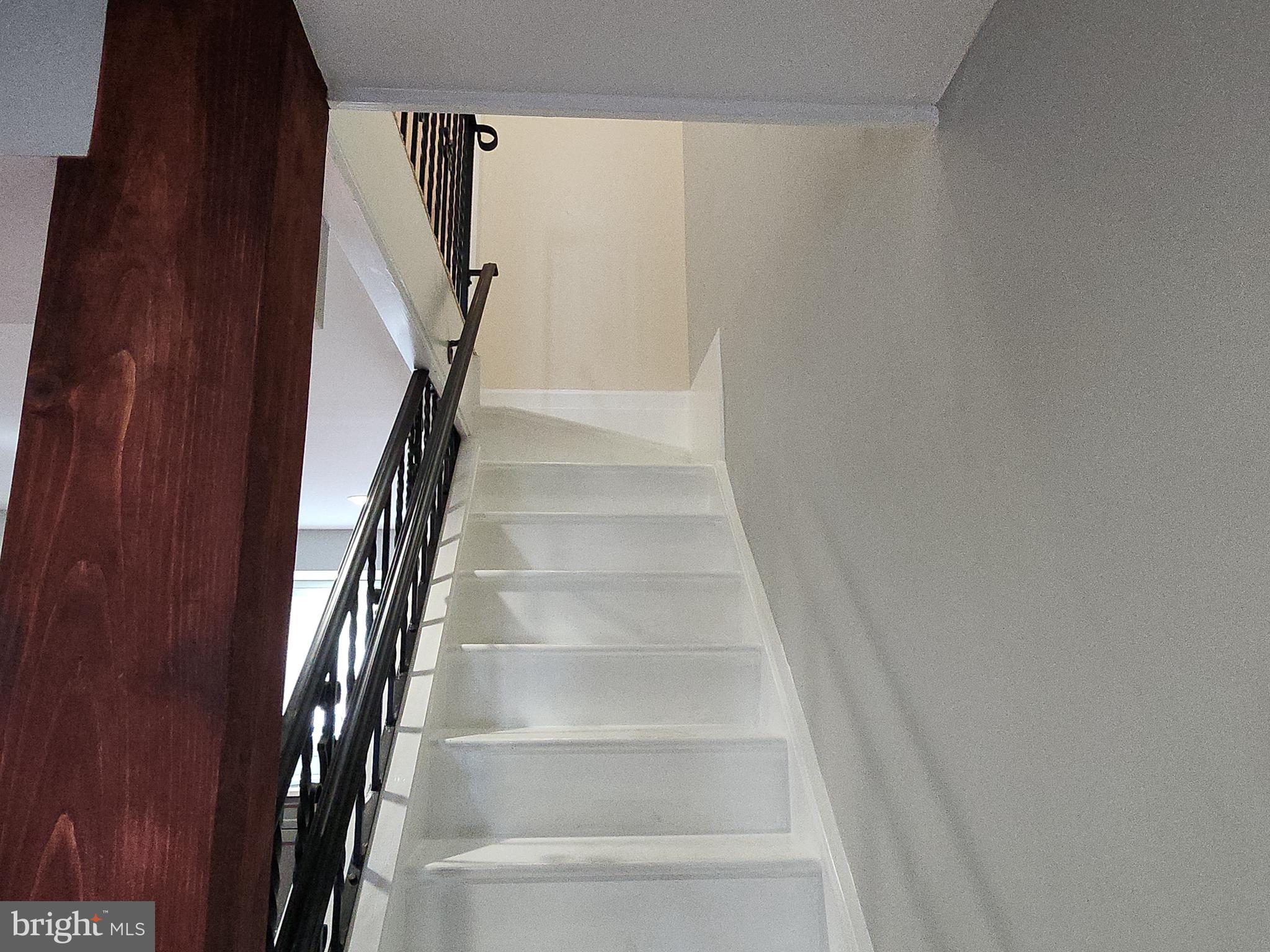 2686 Bridge Street Philadelphia, PA 19137 - Photo 12 of 30 a view of staircase with white walls and white door