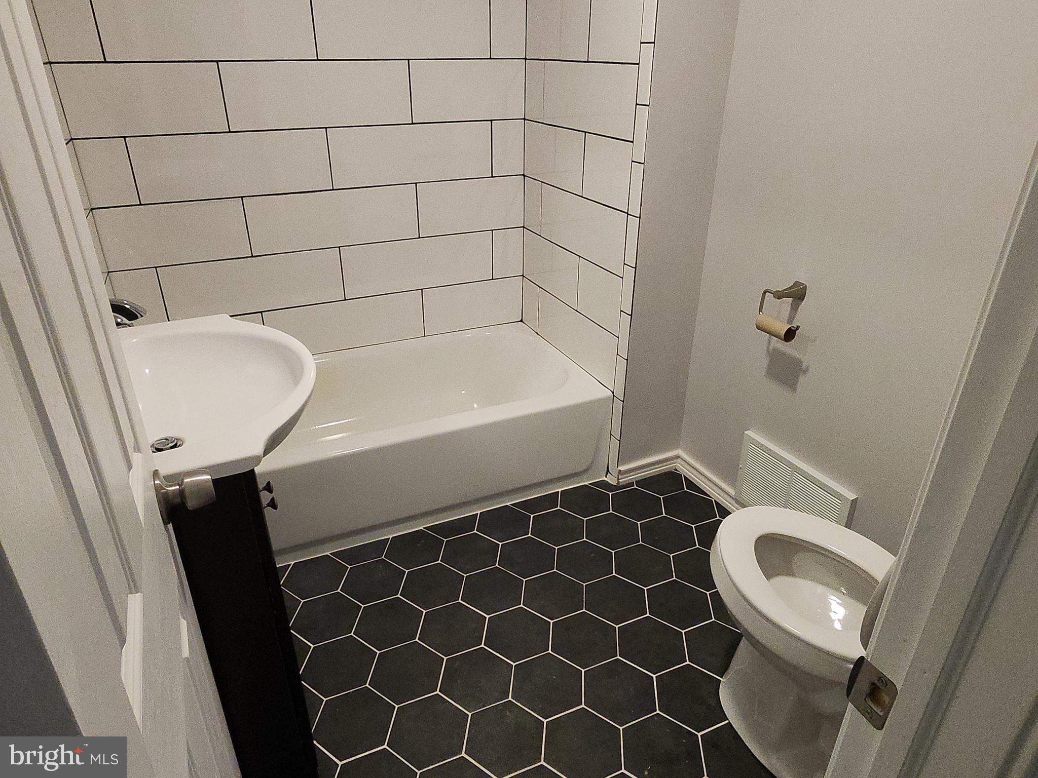 2686 Bridge Street Philadelphia, PA 19137 - Photo 13 of 30 a bathroom with a bathtub and shower