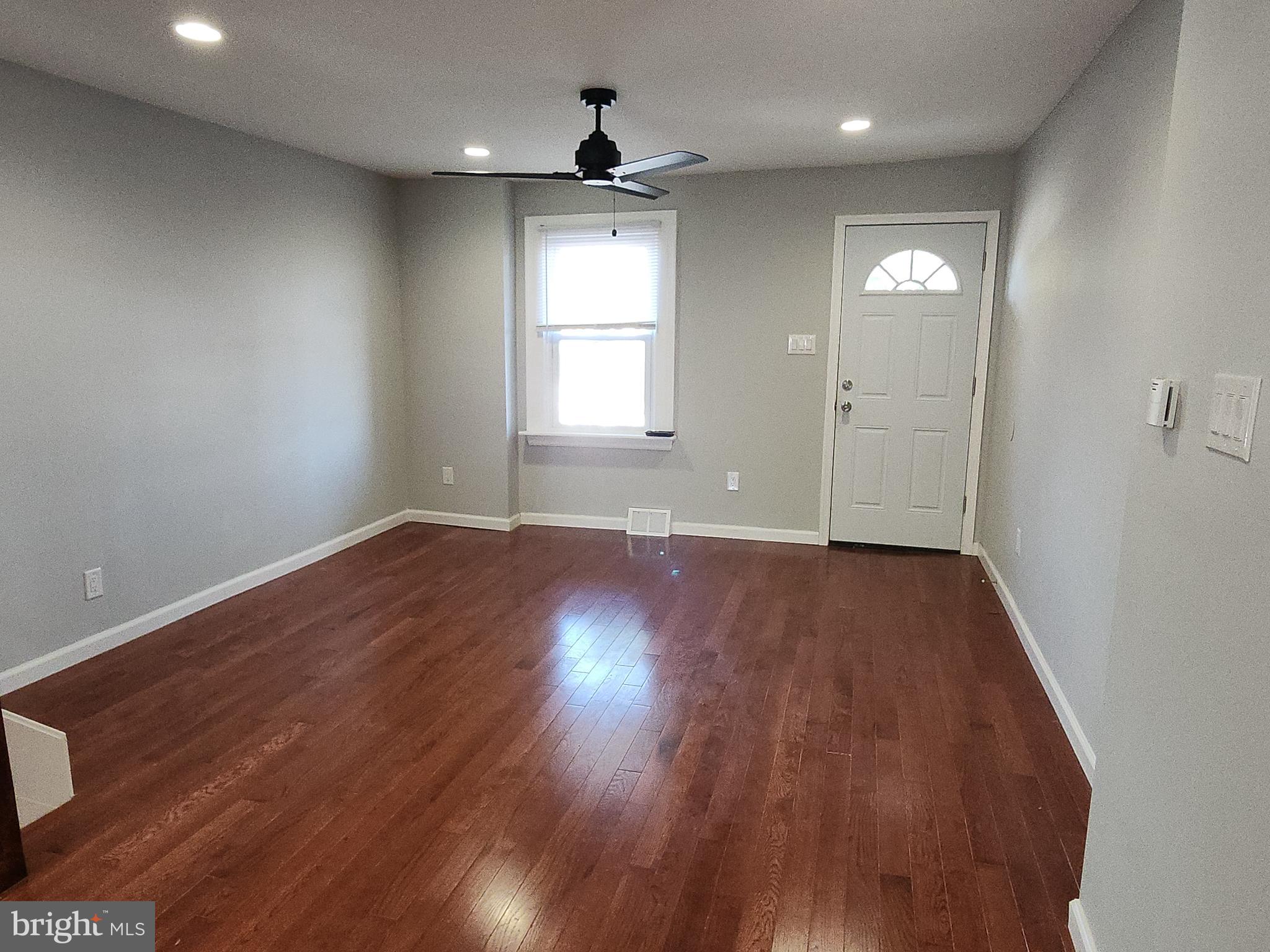 2686 Bridge Street Philadelphia, PA 19137 - Photo 6 of 30 an empty room with wooden floor and windows