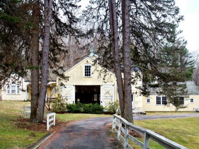 23 Obtuse Road North Brookfield, CT 06804 - Photo 1 of 1 a front view of a house with garden and trees