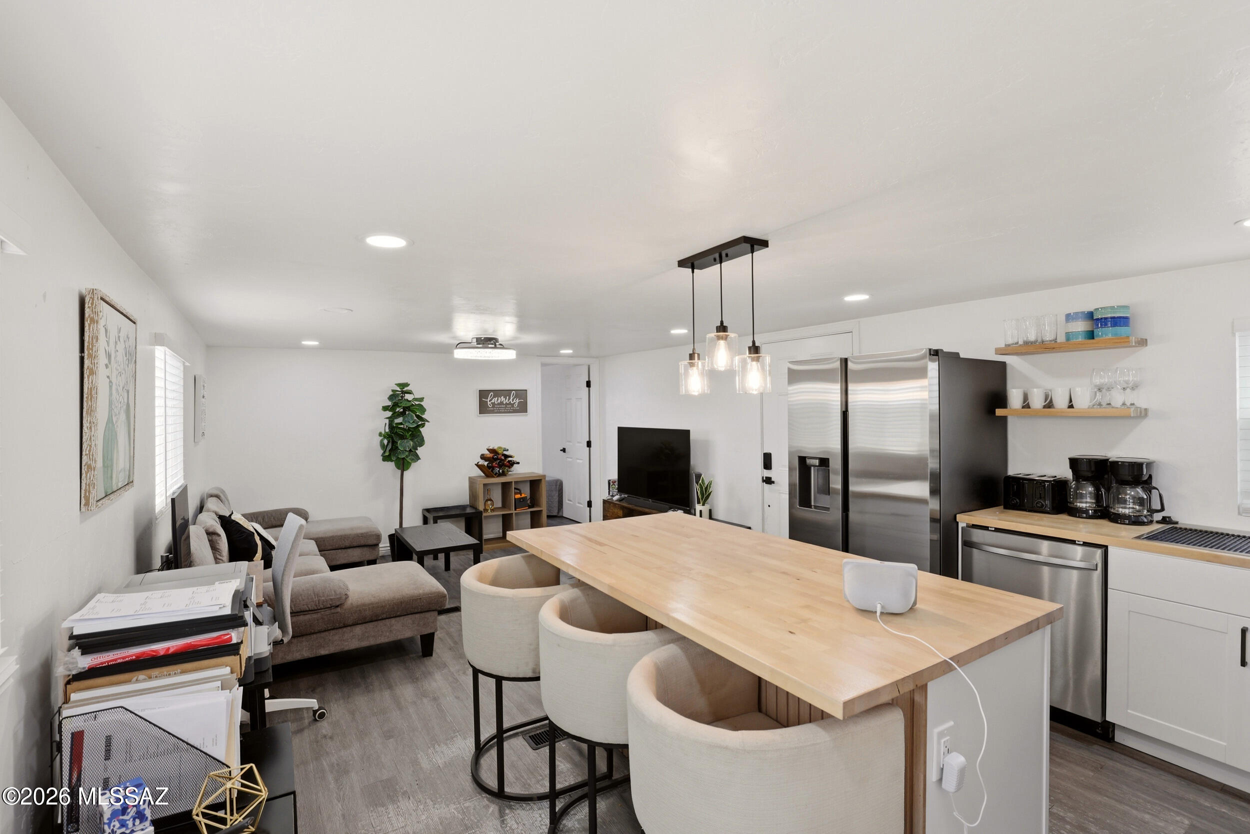 8620 South Sandario Road Tucson, AZ 85736 - Photo 9 of 26 a large kitchen with a table and chairs