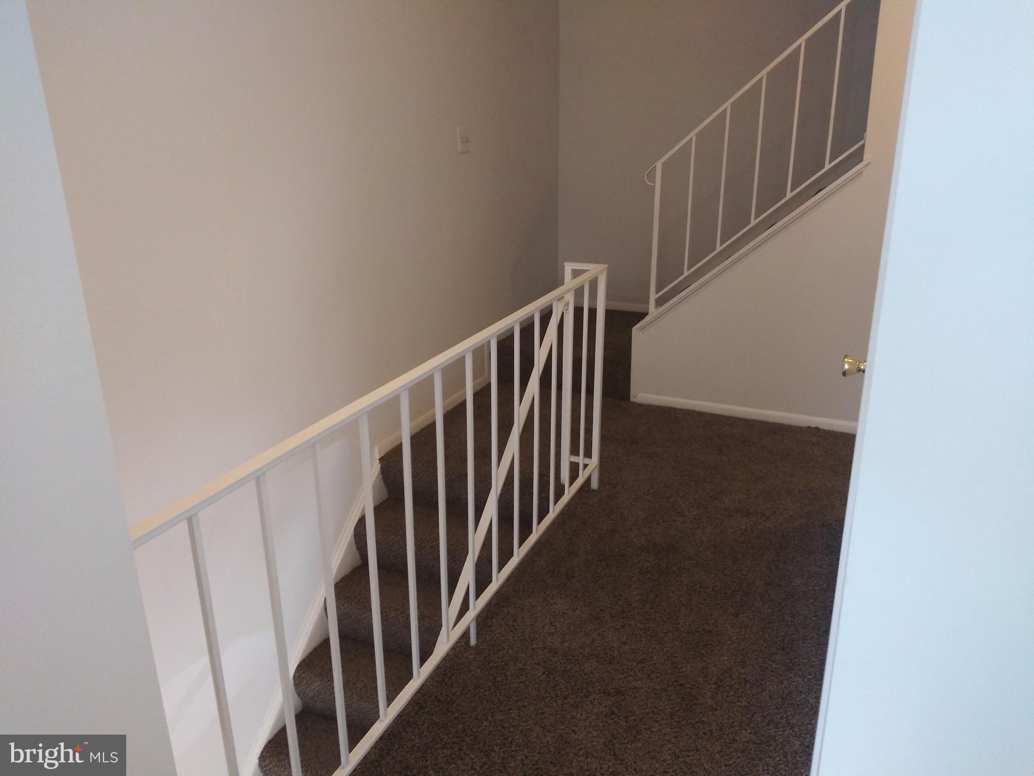 4107 Peppertree Lane Silver Spring, MD 20906 - Photo 15 of 23 Second level hallway leading to 3rd level stairway