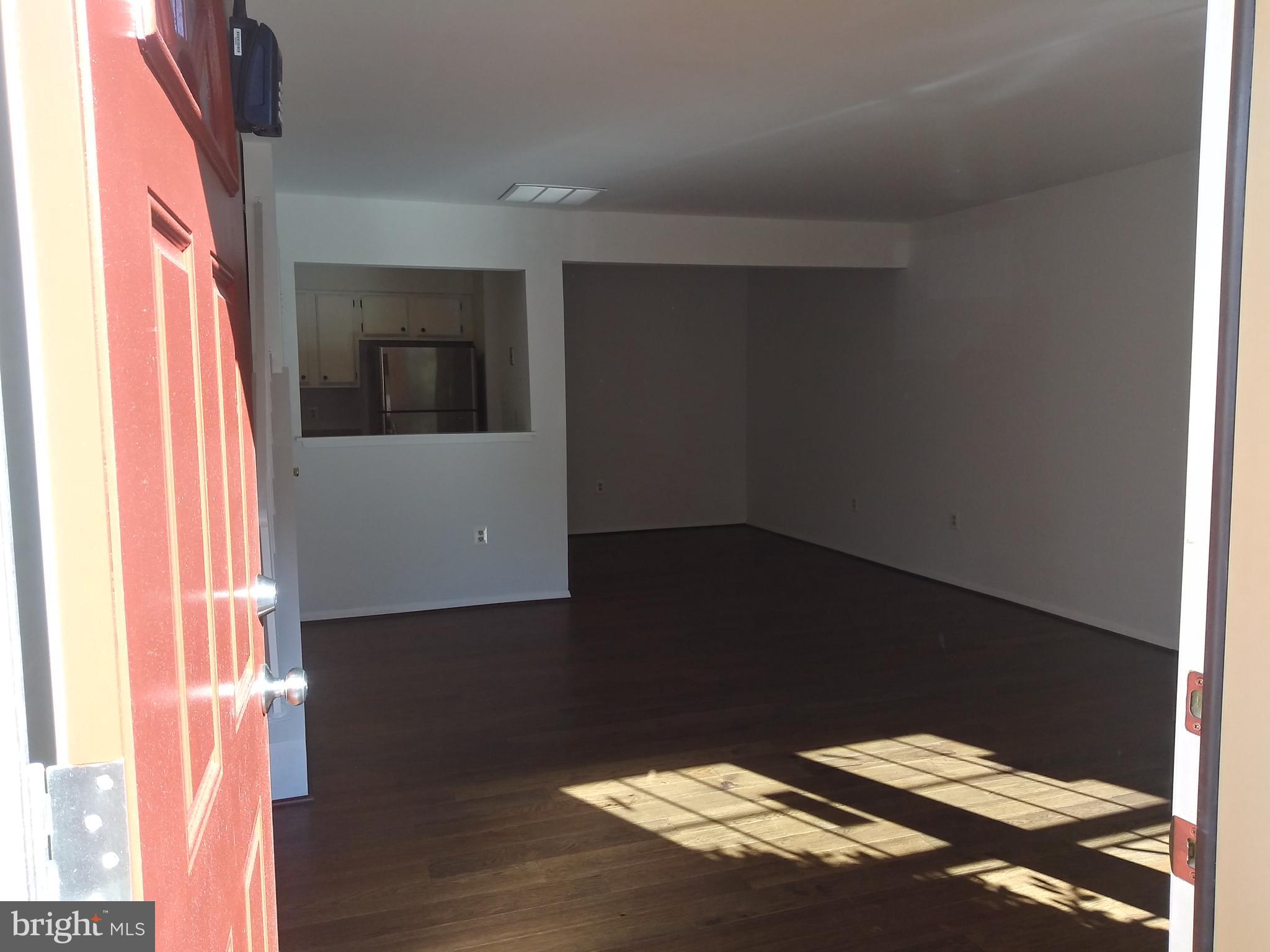 4107 Peppertree Lane Silver Spring, MD 20906 - Photo 3 of 23 Main lvl living/dining room combo w/ new wood flr