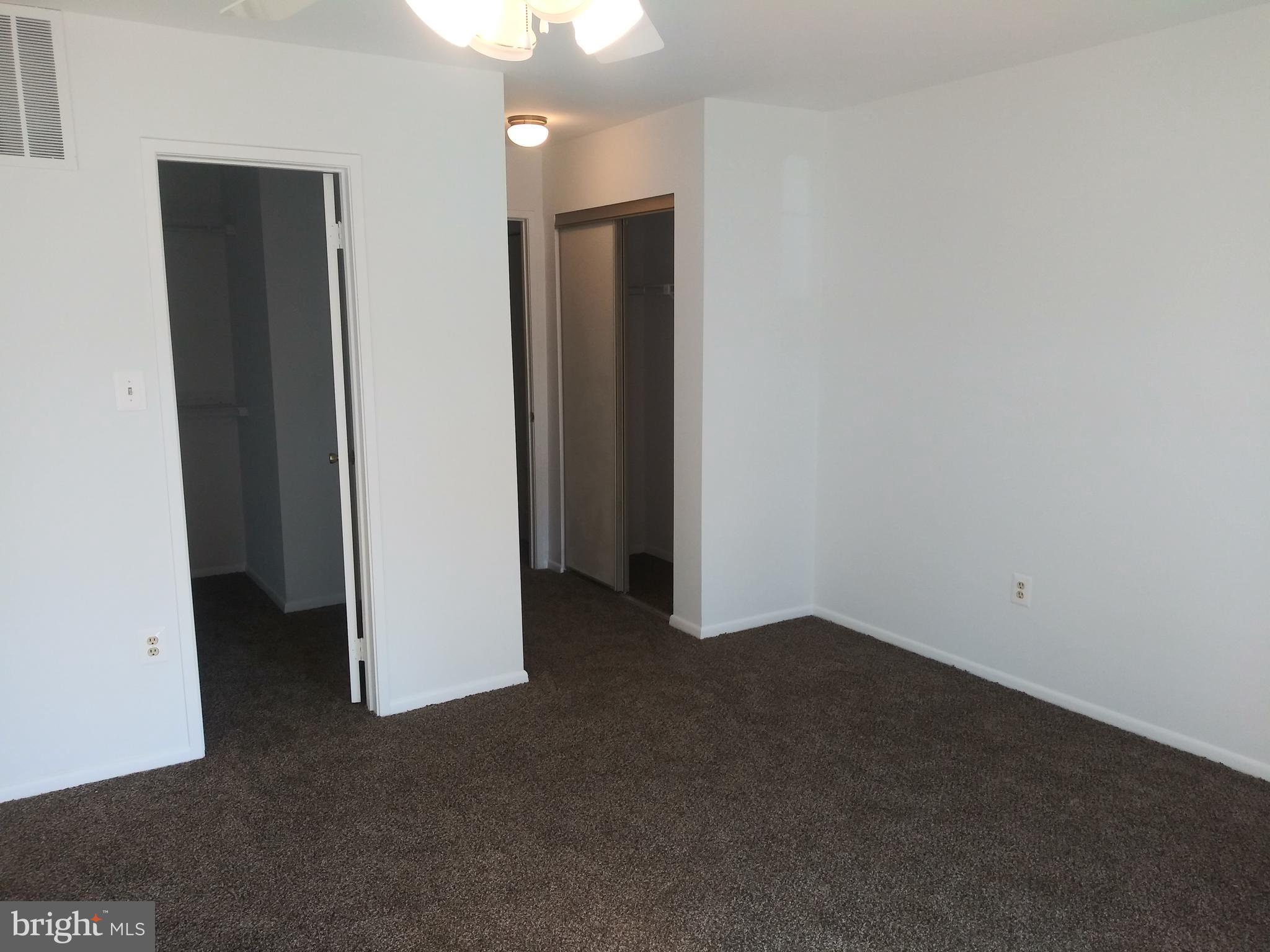 4107 Peppertree Lane Silver Spring, MD 20906 - Photo 21 of 23 Primary bedroom w/ view of walk-in closet & entry
