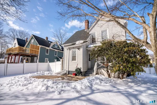 a view of a house with a snow in a yard