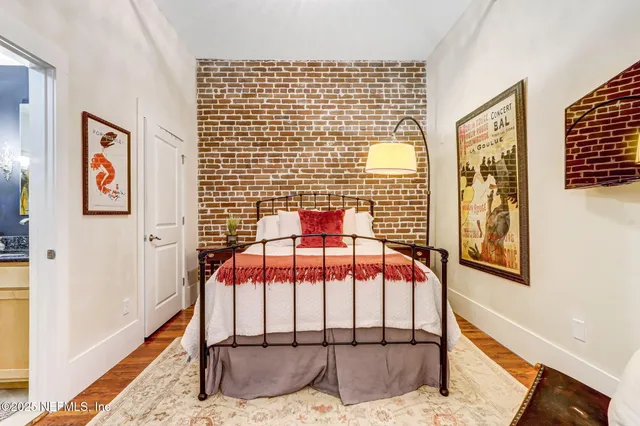 a bathroom with a granite countertop sink mirror vanity and toilet