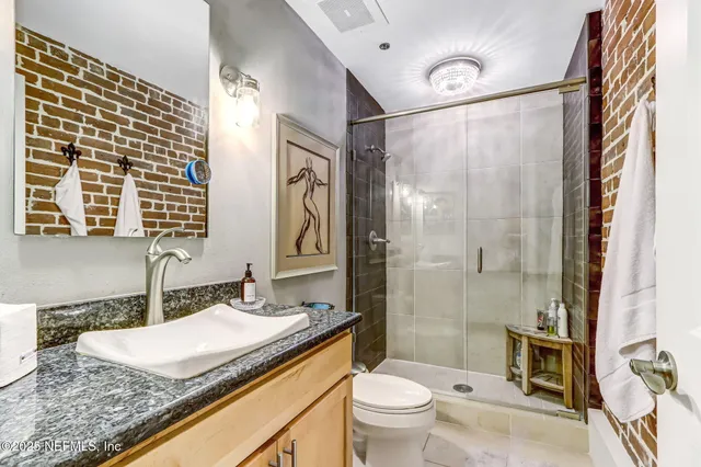 a view of a door with wooden floor and windows