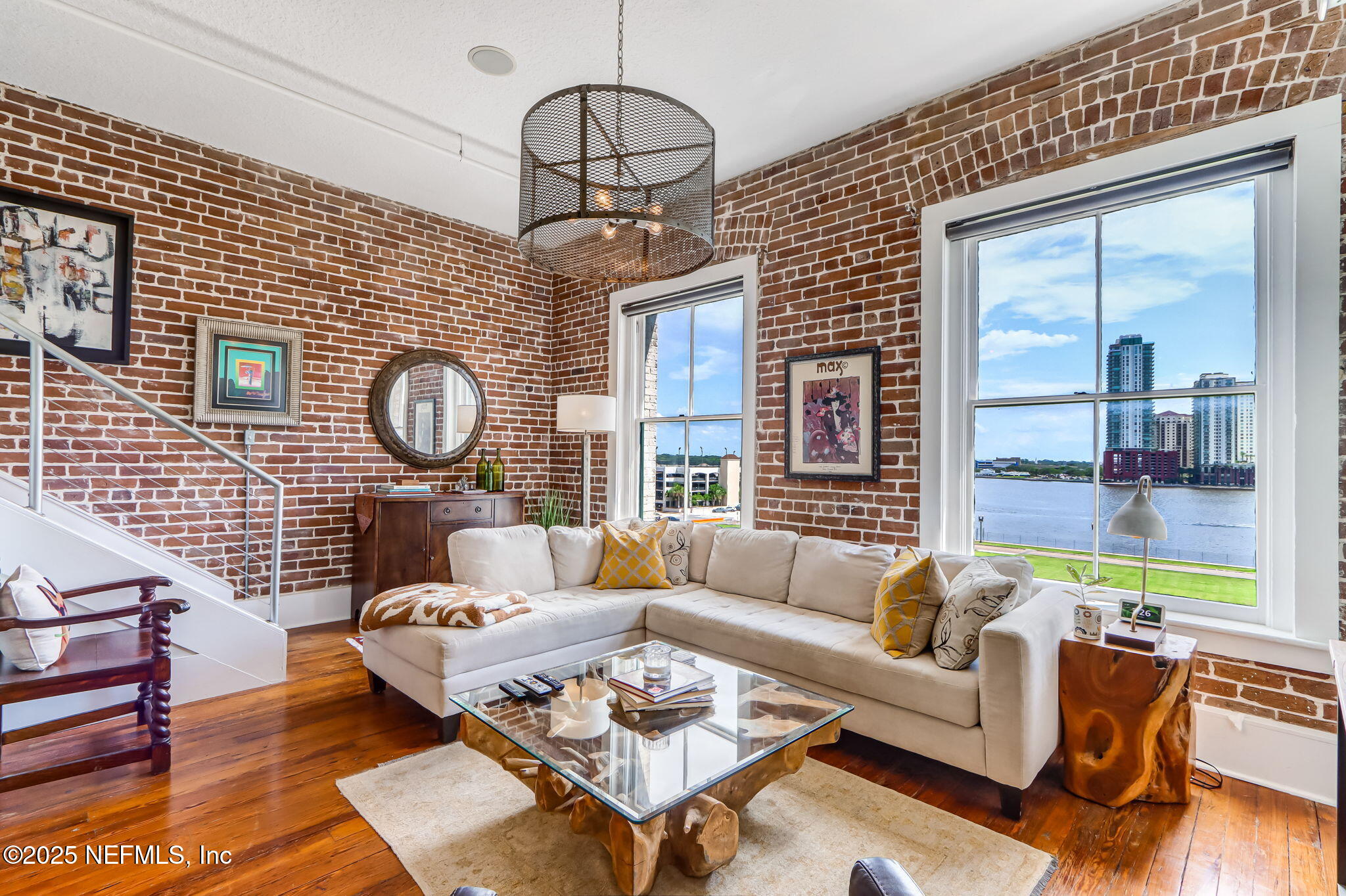301 East Bay Street, Unit 405 Jacksonville, FL 32202 - Photo 2 of 42 a living room with furniture a rug and a window