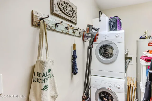 a bedroom with furniture and a flat screen tv