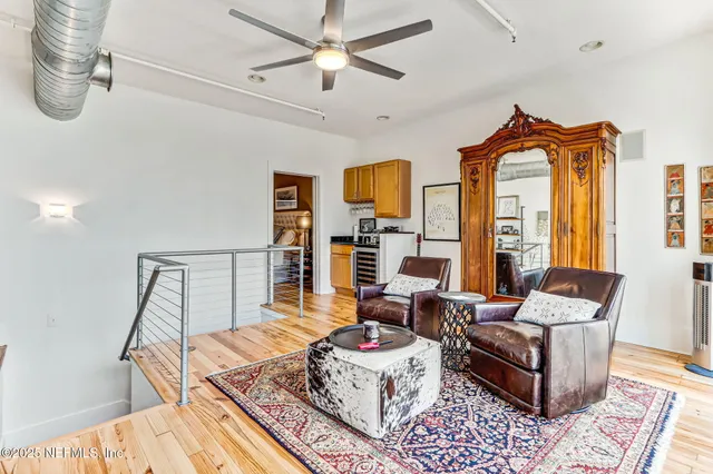 a kitchen with stainless steel appliances a stove a sink and a refrigerator