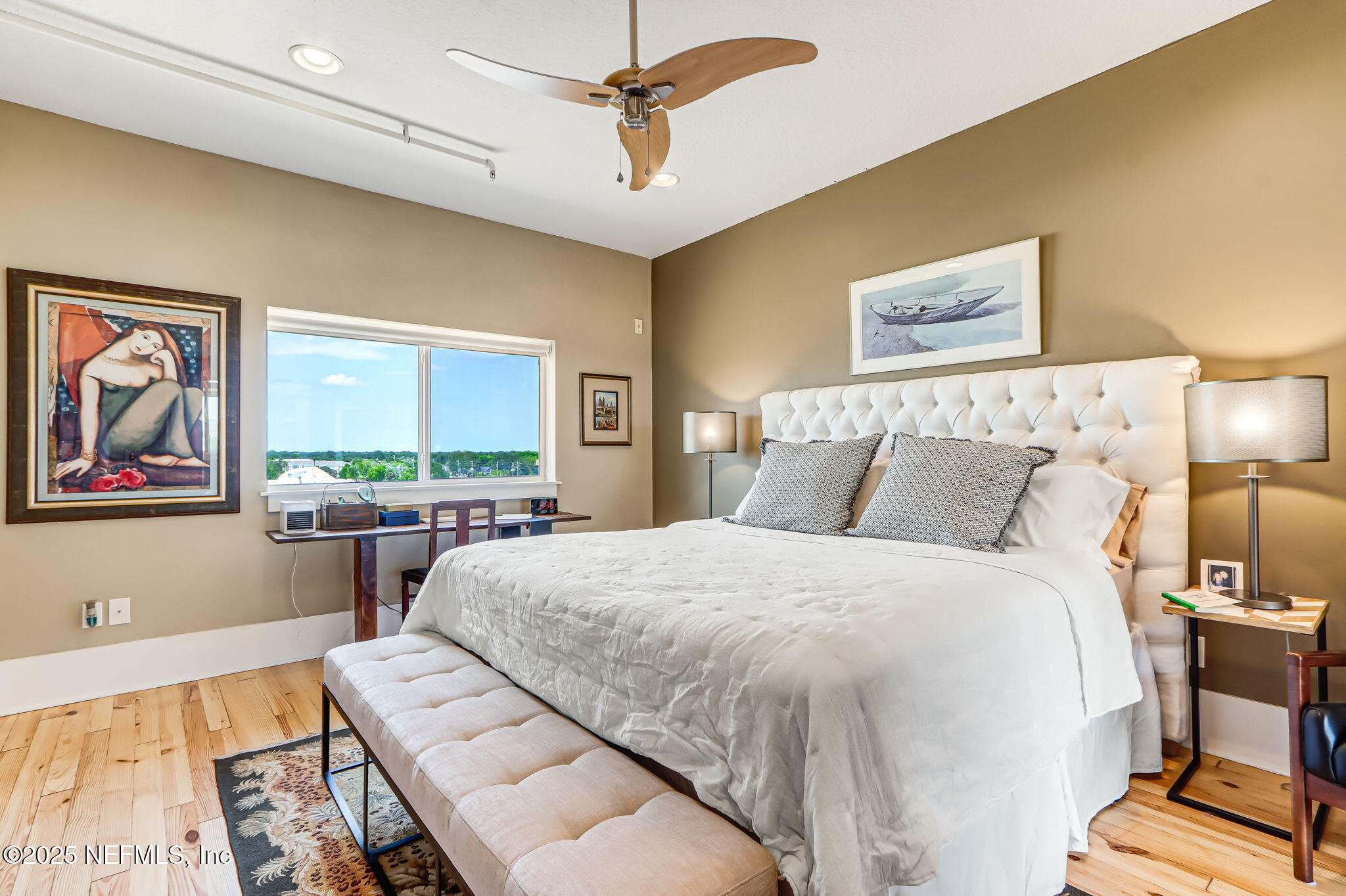 301 East Bay Street, Unit 405 Jacksonville, FL 32202 - Photo 28 of 42 a bed sitting in a bedroom next to a window