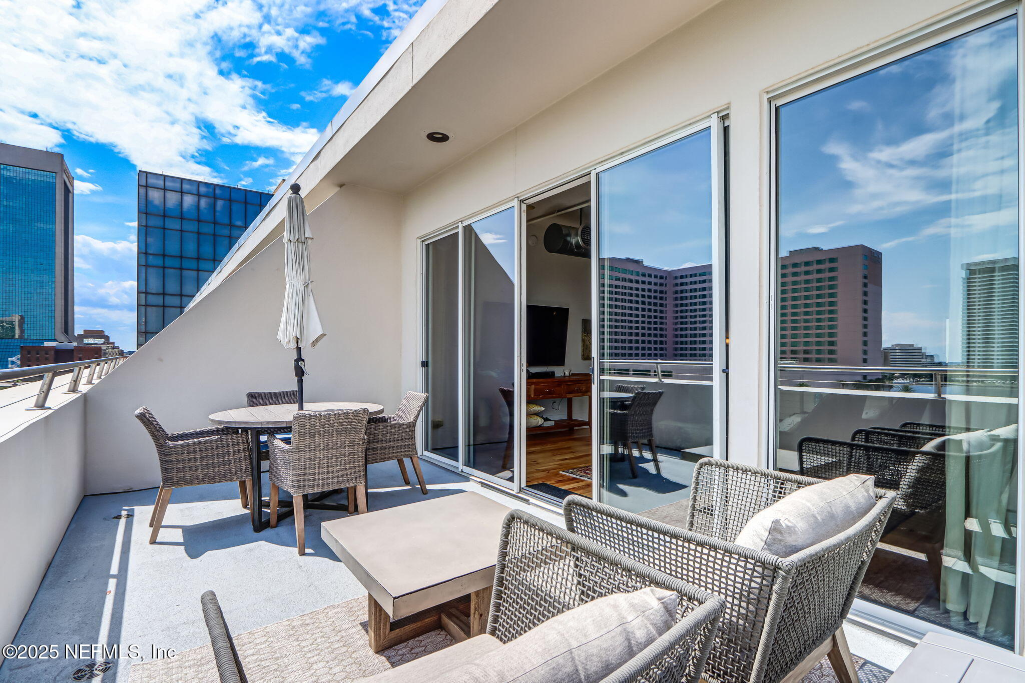 301 East Bay Street, Unit 405 Jacksonville, FL 32202 - Photo 32 of 42 a building outdoor space with patio furniture