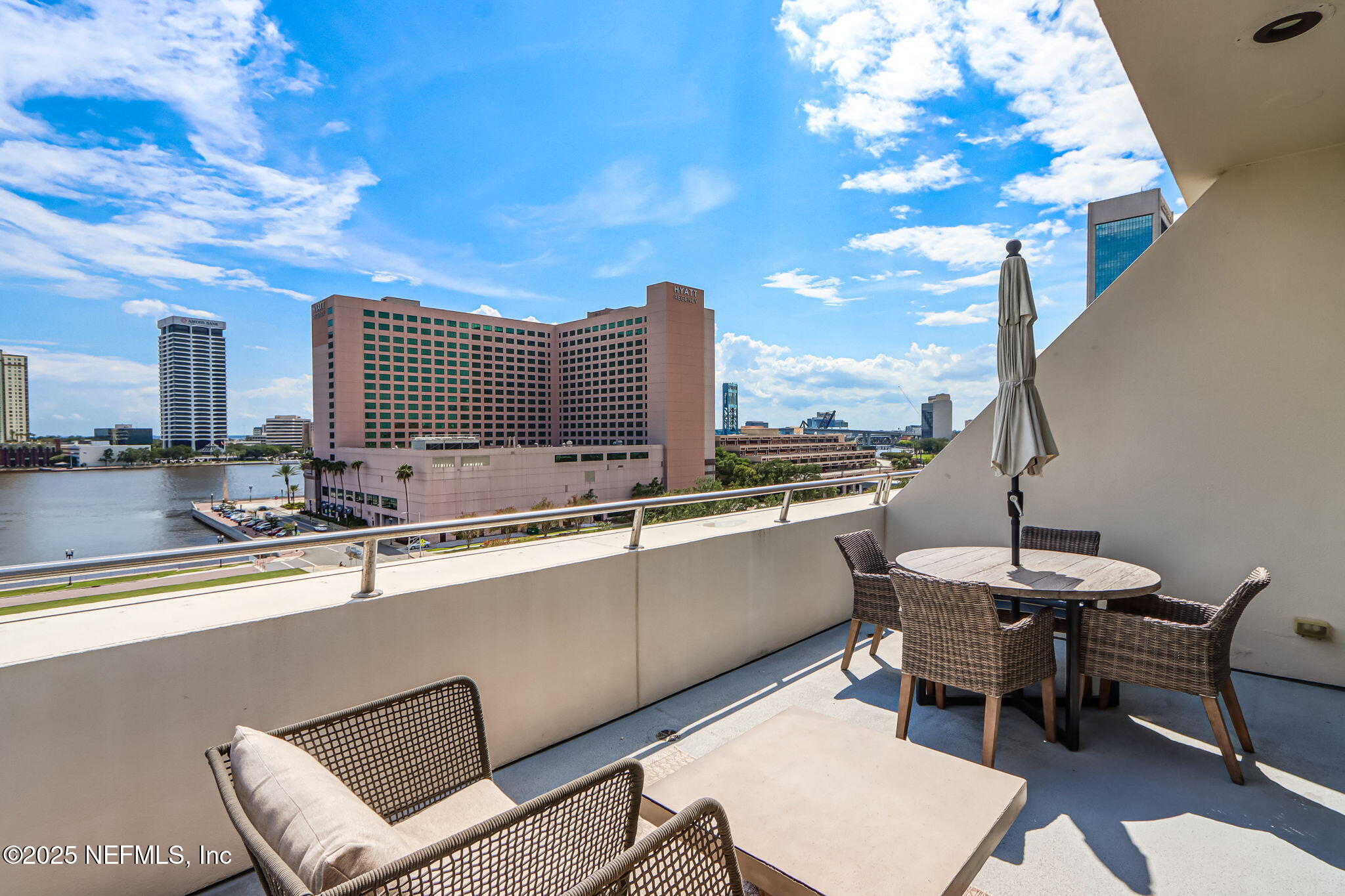 301 East Bay Street, Unit 405 Jacksonville, FL 32202 - Photo 34 of 42 a view of a kitchen with a dining table and chairs