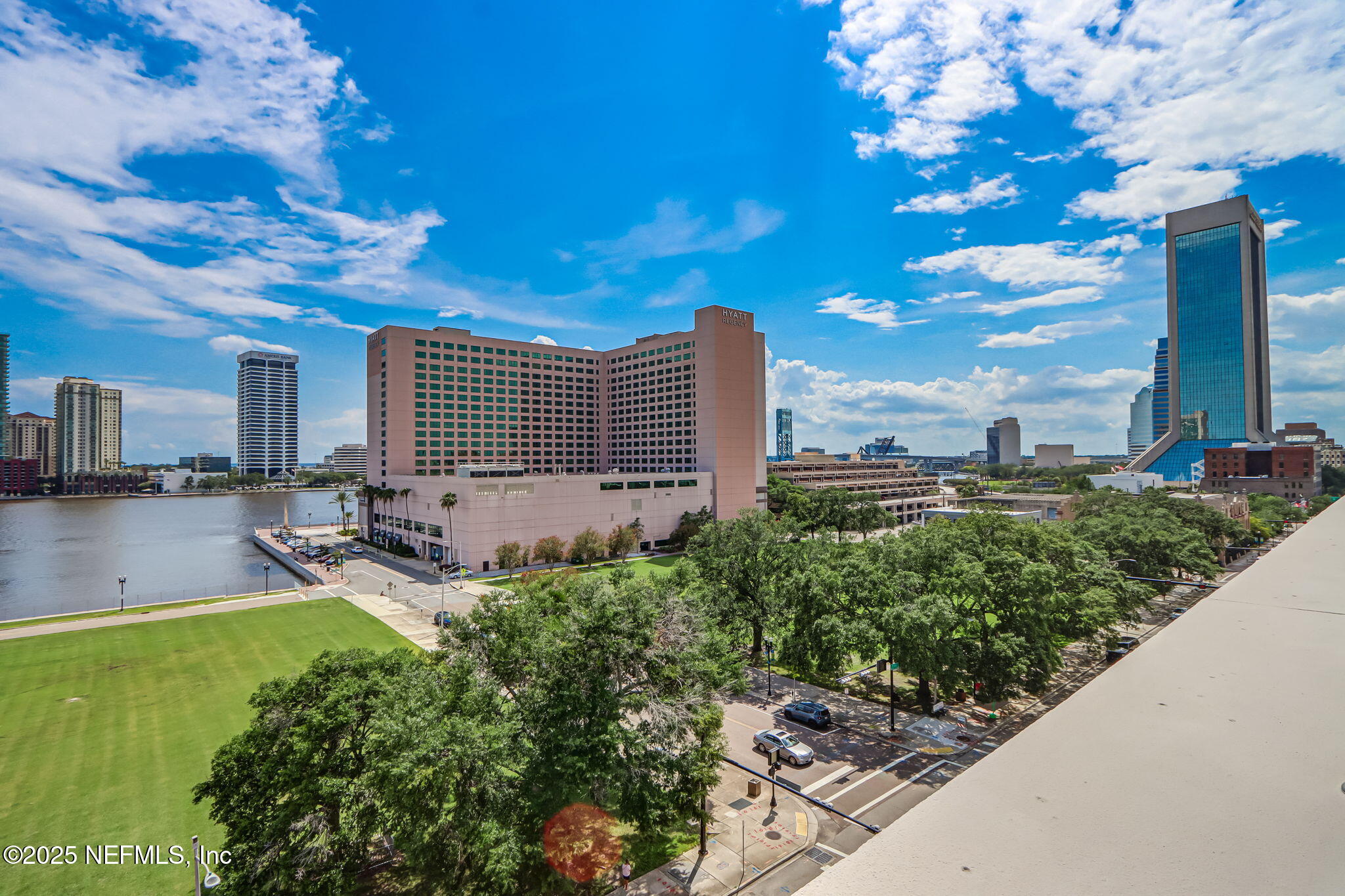 301 East Bay Street, Unit 405 Jacksonville, FL 32202 - Photo 35 of 42 a view of a patio with table and chairs and potted plants