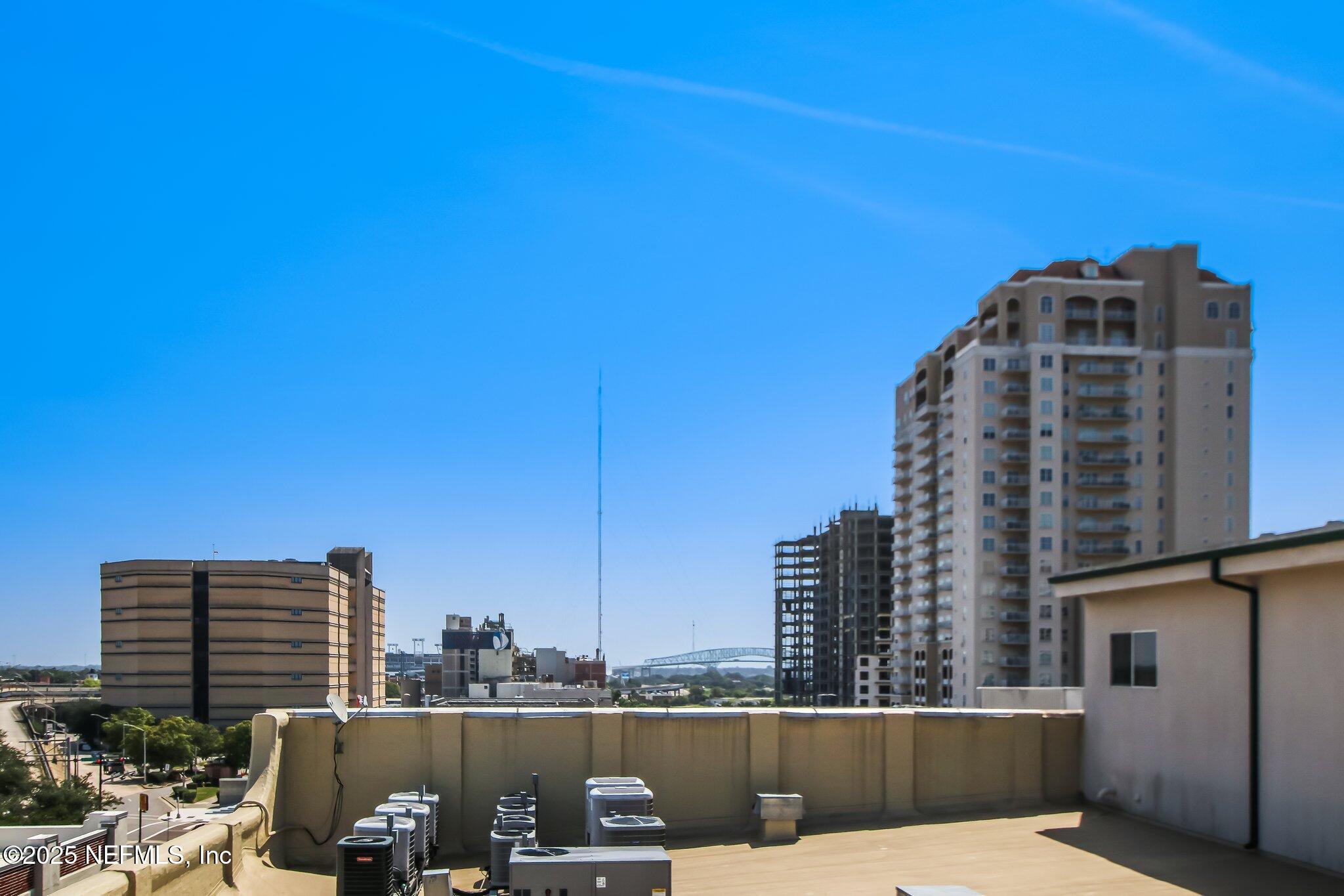 301 East Bay Street, Unit 405 Jacksonville, FL 32202 - Photo 41 of 42 a view of roof with potted plants and wooden fence