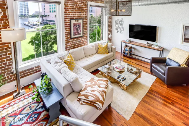 a living room with furniture and a flat screen tv