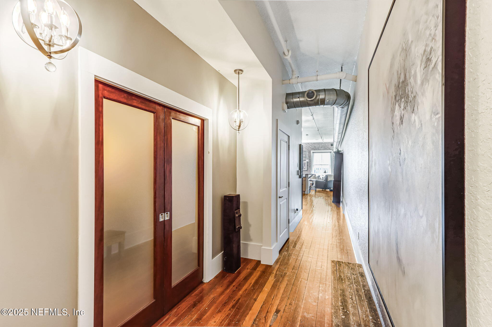 301 East Bay Street, Unit 405 Jacksonville, FL 32202 - Photo 8 of 42 a view of a hallway with wooden floor