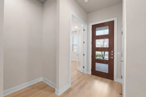 wooden floor in an empty room with a mirror