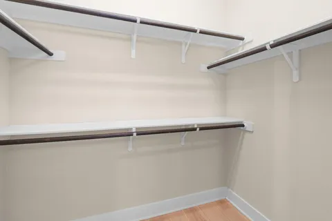 a view of a room with shelf on the wall