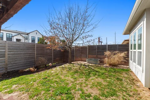 a view of a house with a small yard